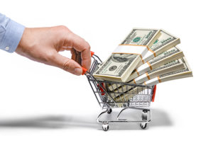 money in shopping basket being pushed_21645665_l